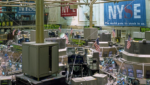 Trading floor of the New York Stock Exchange with NYSE banners and American flags