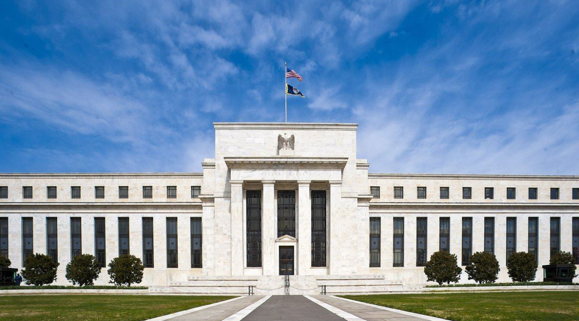 The Marriner S. Eccles Federal Reserve Board Building in Washington, D.C., under a blue sky